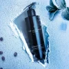 Flacone Cryosuite Gel immerso nel ghiaccio con chicchi di caffè e foglie criogeniche